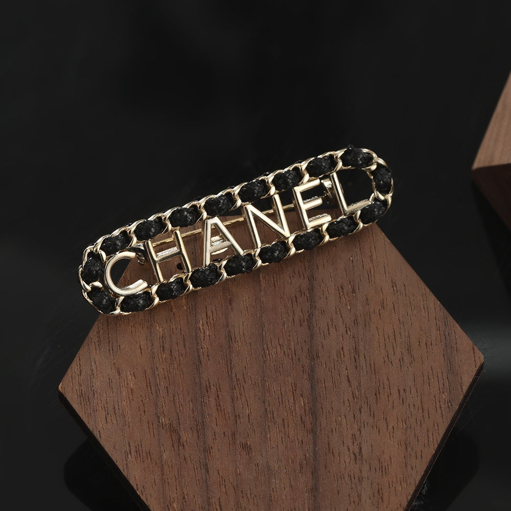 Chanel Leather Brass Brooch