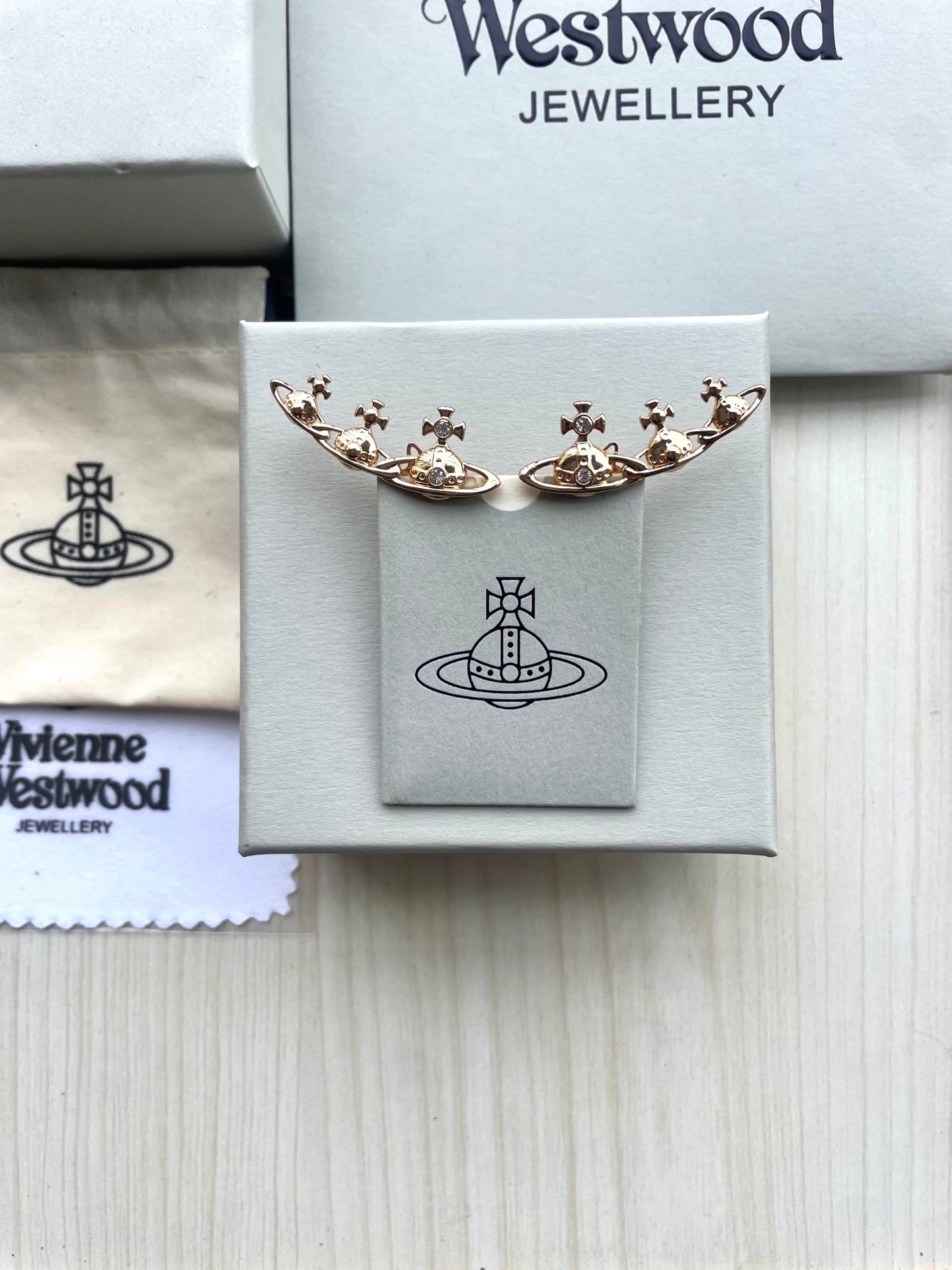 Row of Saturn Stud Earrings