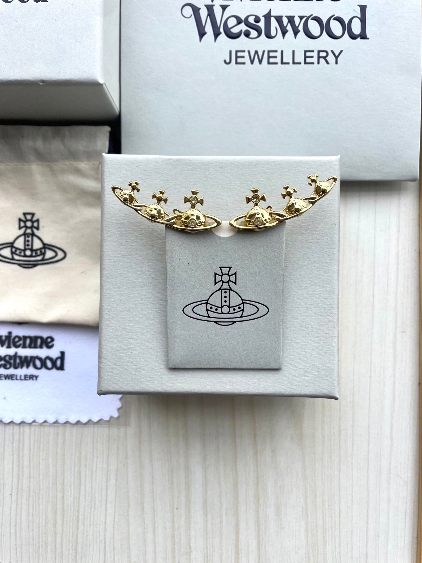 Row of Saturn Stud Earrings